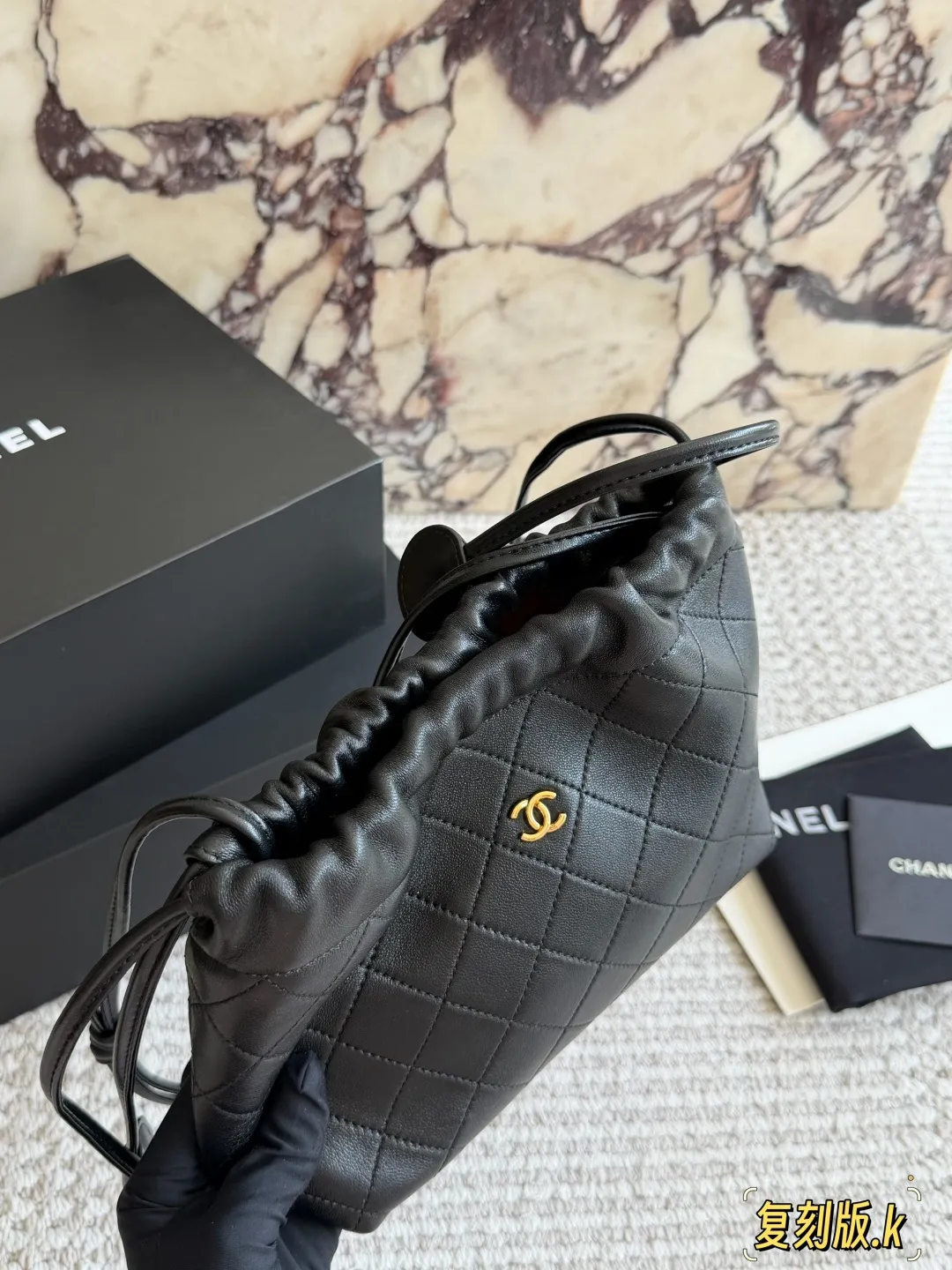 Chanel 26S Quilted Lambskin Drawstring Bucket Bag D34018235 — view 2