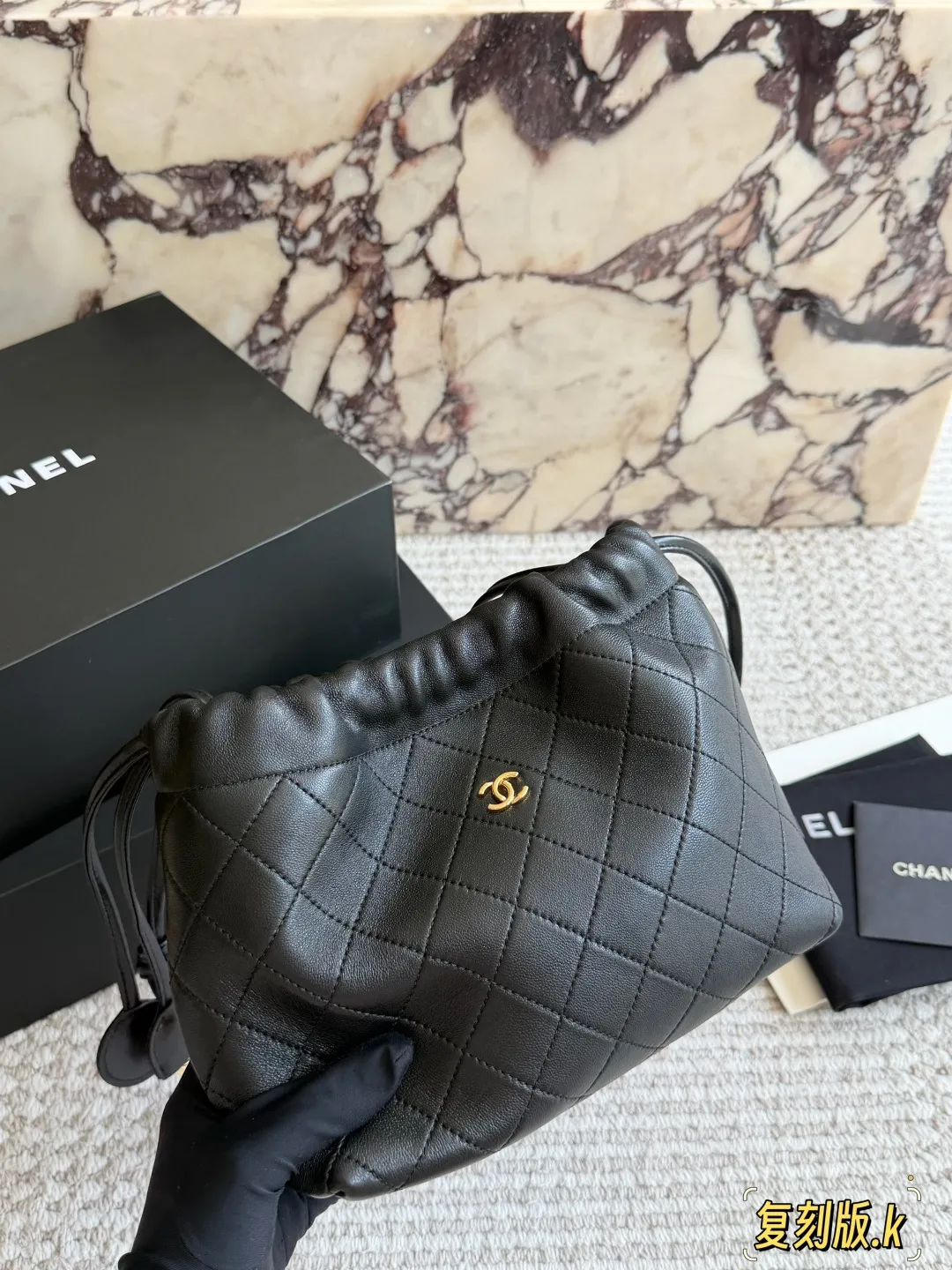 Chanel 26S Quilted Lambskin Drawstring Bucket Bag D34018235 — view 4