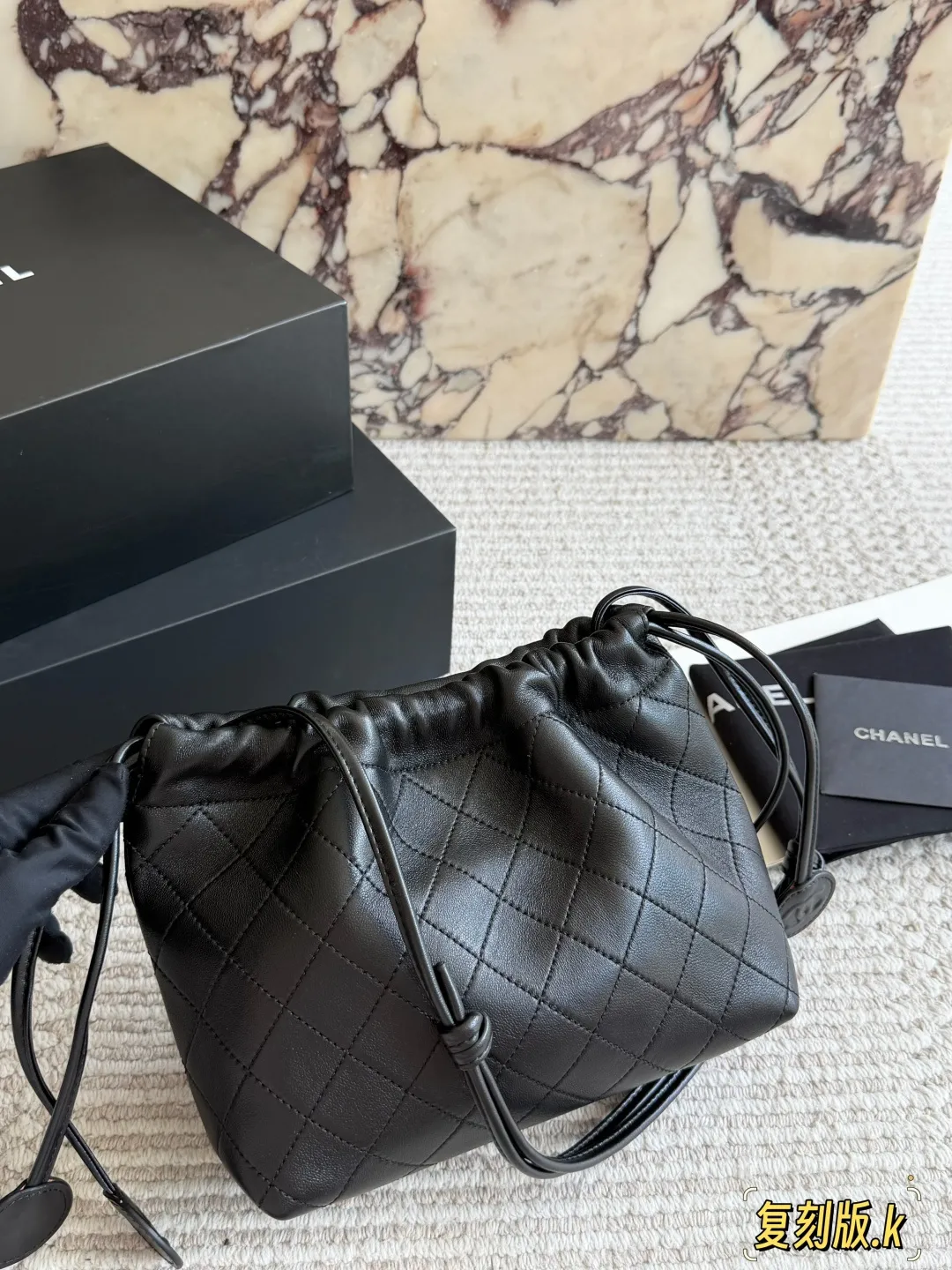 Chanel 26S Quilted Lambskin Drawstring Bucket Bag D34018235 — view 6