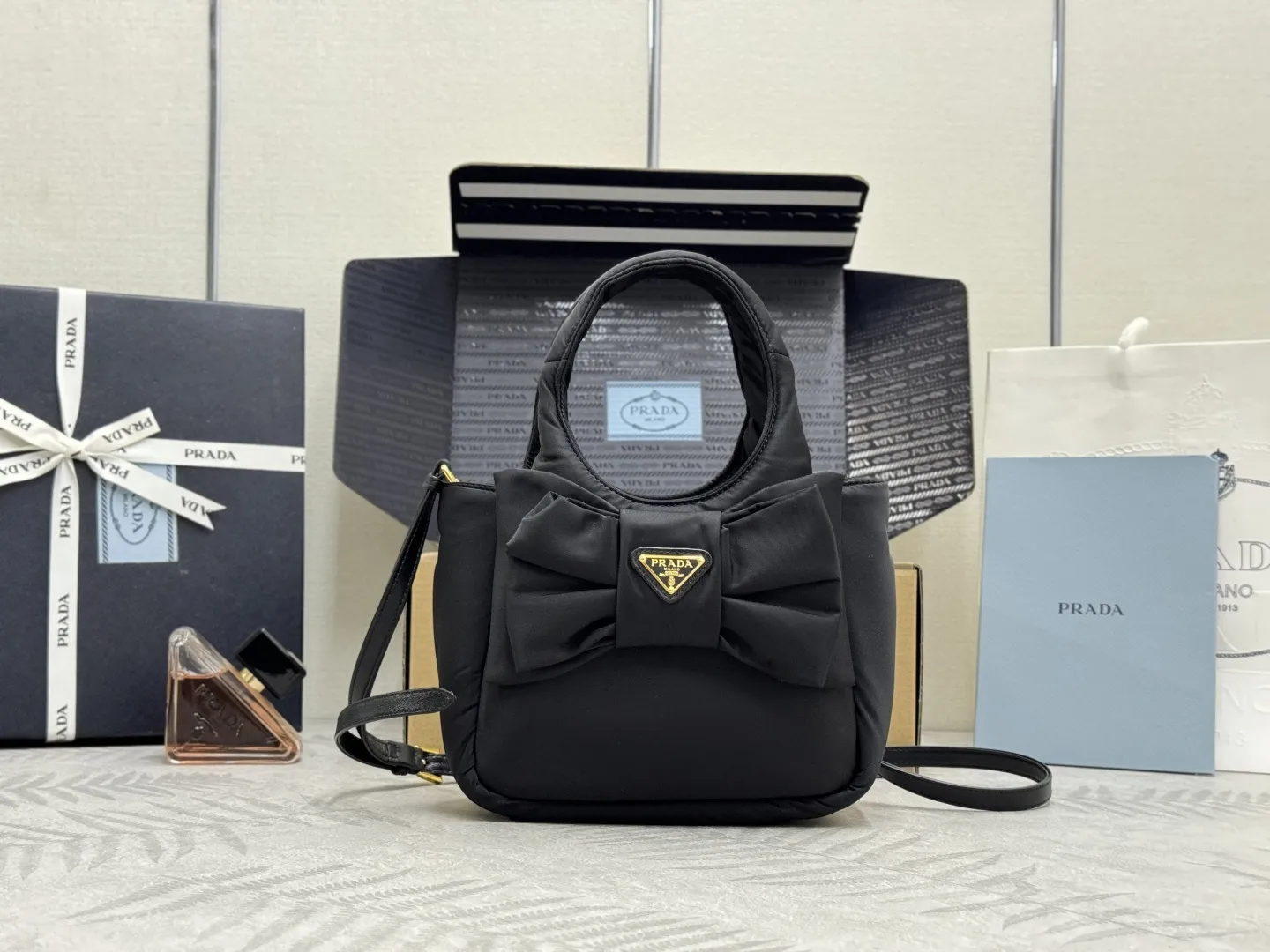 Prada Bow-Detail Padded Nylon Shoulder Bag D76011233
