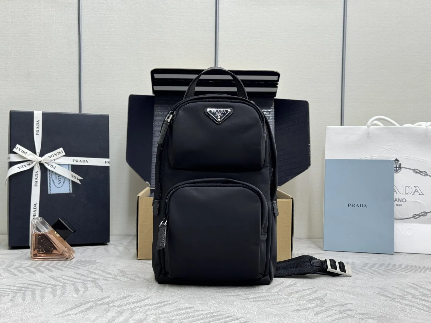 Re-Nylon and Saffiano Leather Sling Backpack D69011239