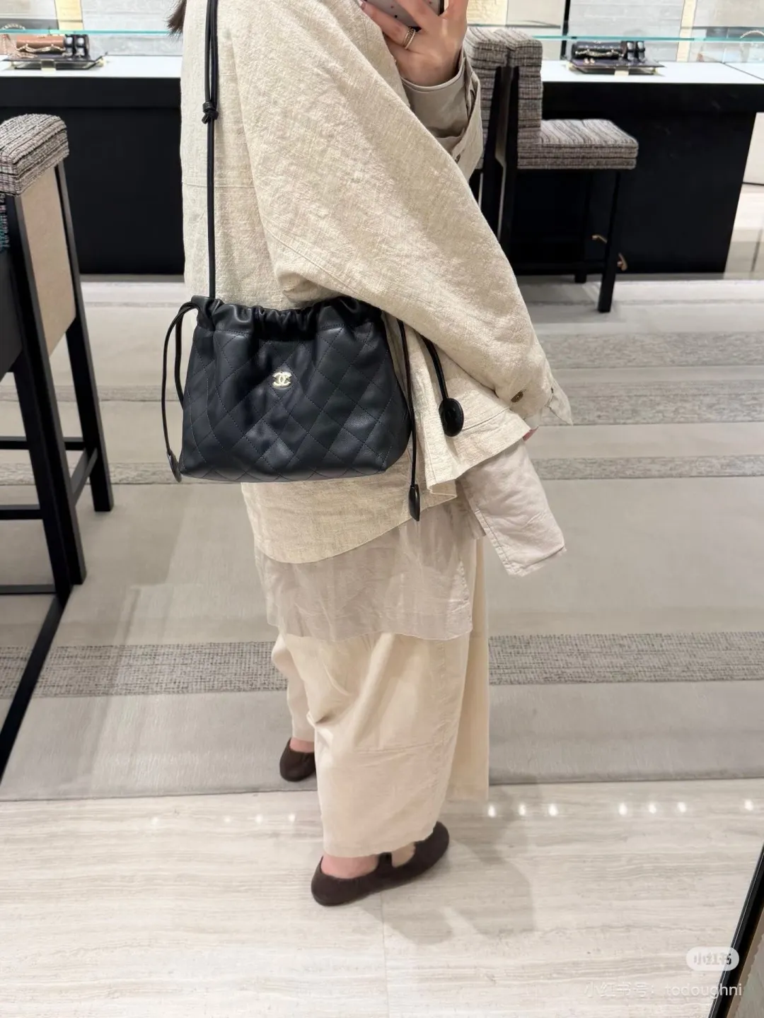 Chanel Quilted Leather Drawstring Bucket Bag D34018233 — view 8